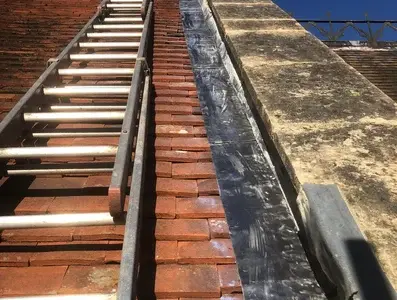 Roof abutment with a new lead detail installed