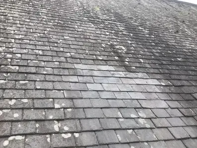 Slate roof repair with damaged slates replaced